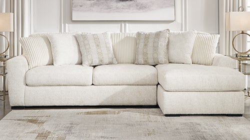Signature Design by Ashley Chessington 2-Piece Sectional with Chaise in Ivory